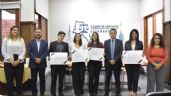 Reconocimiento a cuatro flamantes abogados